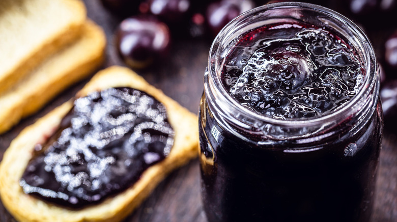 Open jar of grape jelly