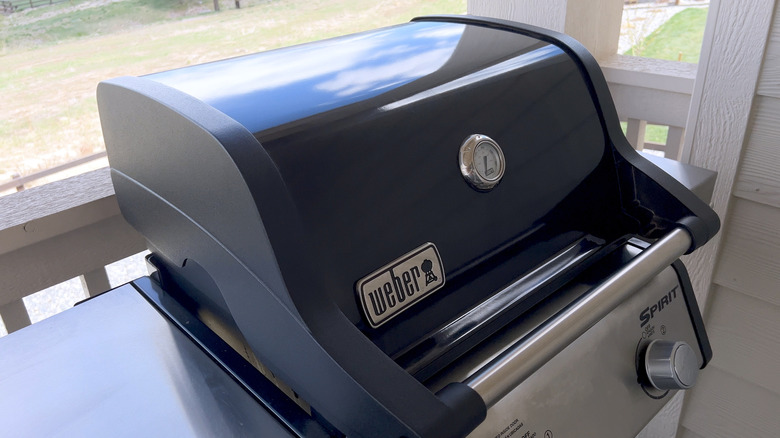 A Weber Spirit Grill sits on a balcony.