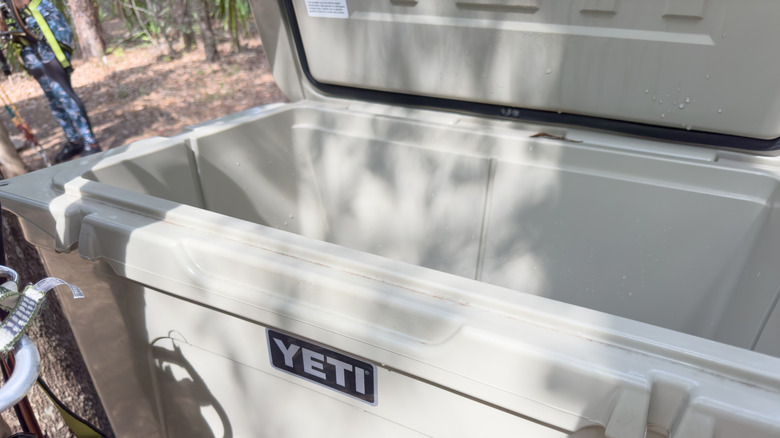 Open white Yeti cooler in the back of a truck