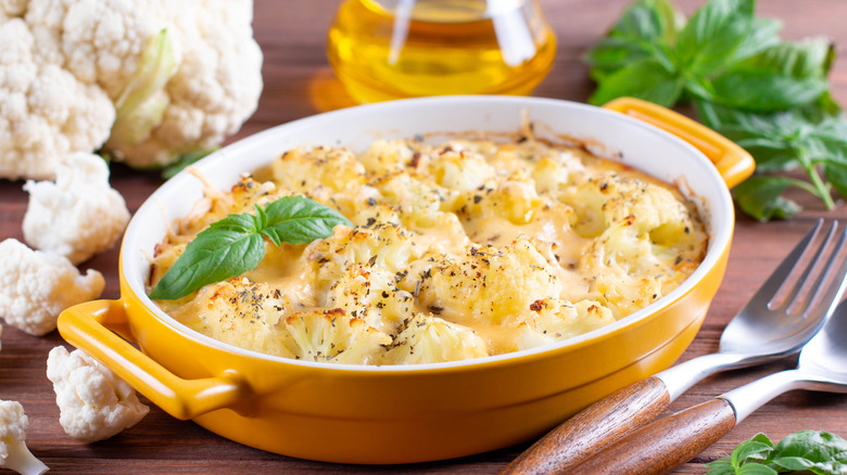 Cheesy cauliflower casserole on table