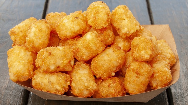 tater tots in cardboard container