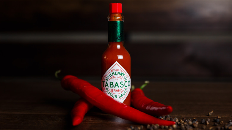 tabasco sauce with tabasco peppers and black pepper