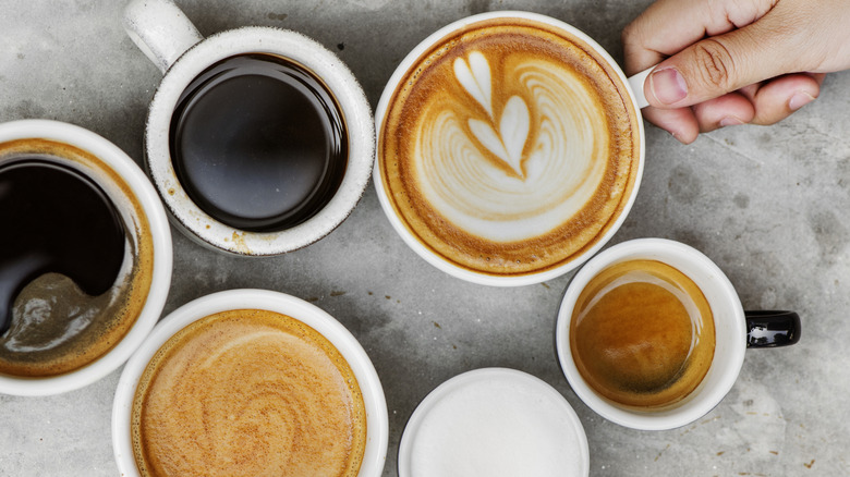 Overhead view of various coffee drinks.