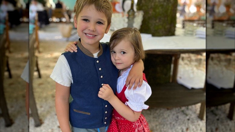 Christopher Kimball's children, Oliver and Rike, smiling with their arms around each other