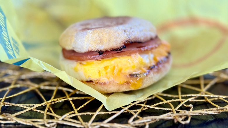 Egg McMuffin sitting on its wrapper
