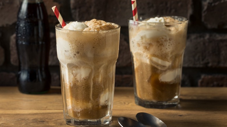 two root beer floats on wooden surface