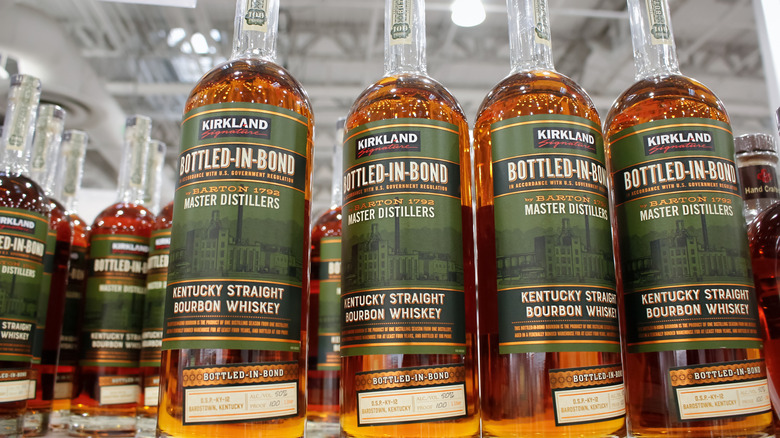 Kirkland Signature Bottled-In-Bond lined up on a store shelf.