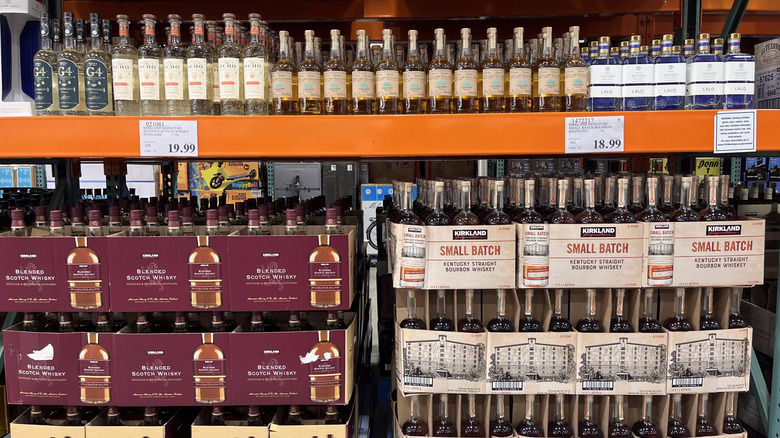 A display of Costco Kirkland Signature liquor including blended Scotch whisky and Kentucky bourbon