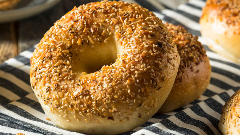 Two bagels topped with seeds