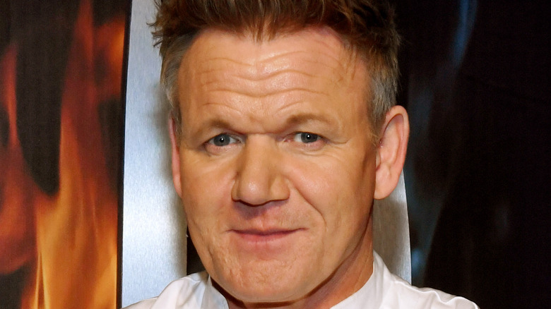 Gordon Ramsay in front of a Fox sign