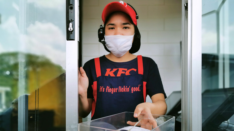 KFC drive thru worker at window