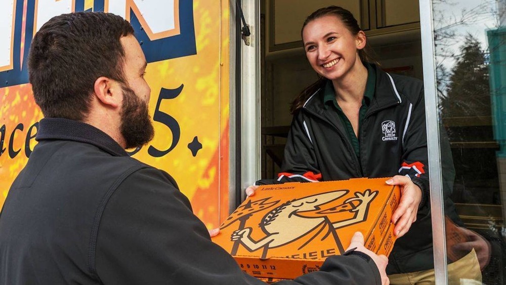 Little Caesars employee smiling