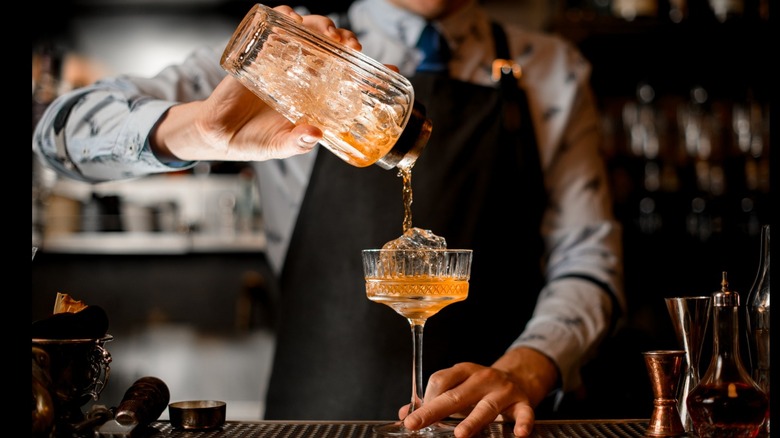 Bartender pouring cocktail