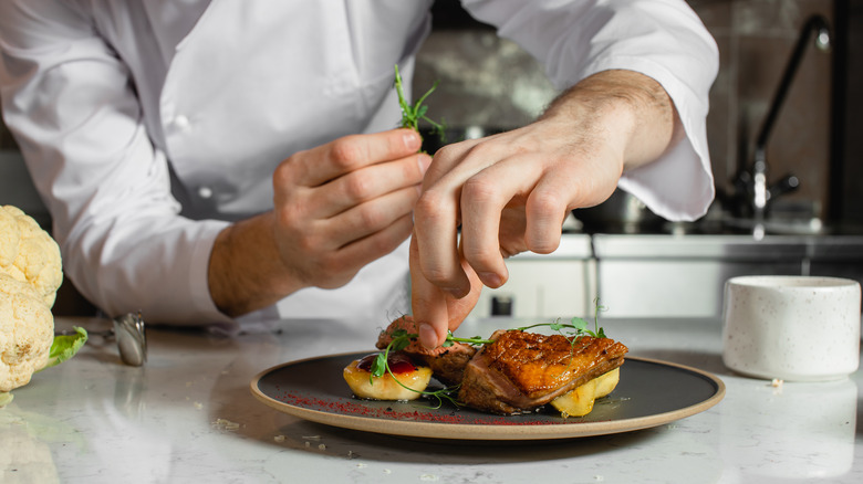 Caterer preps a plate