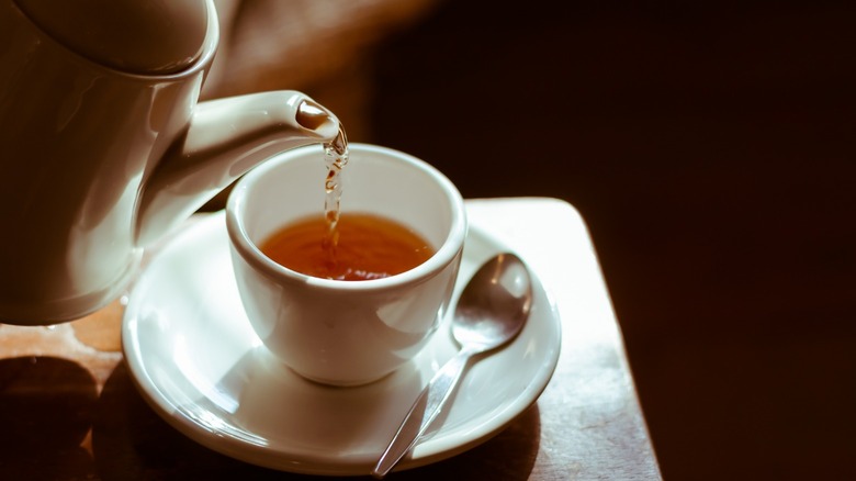 Cup of tea being poured 