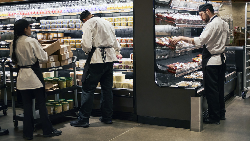 Wegmans employees stocking shelves