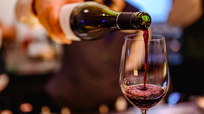 pouring red wine