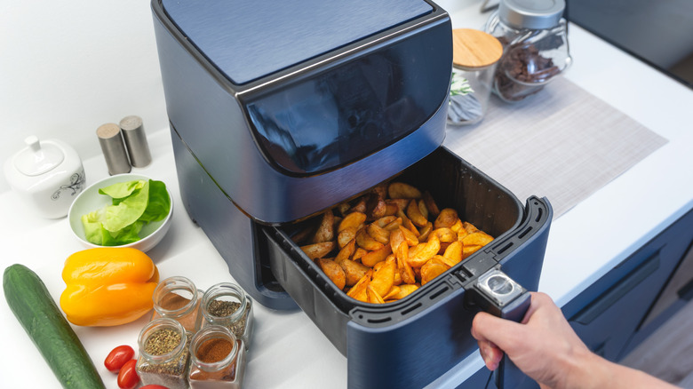 Air fryer with potatoes