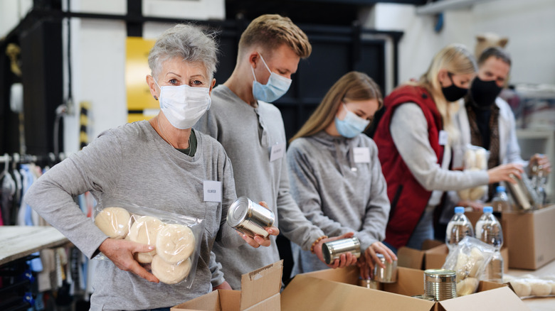 Aid workers packing food