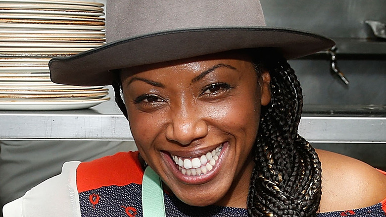 Nyesha Arrington smiling in kitchen