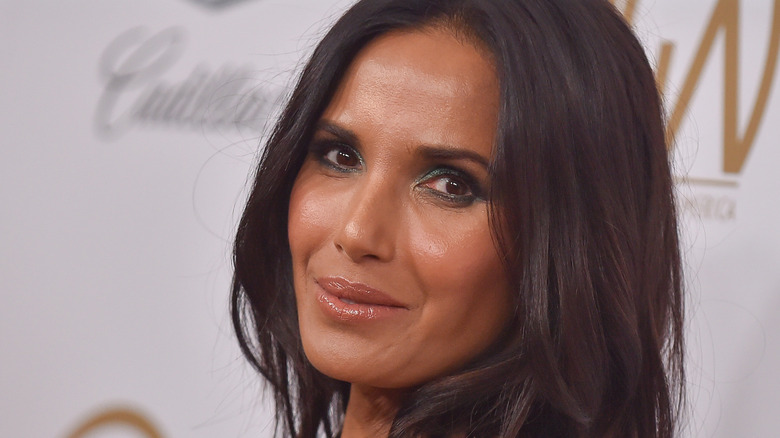 Padma Lakshmi smiling slightly