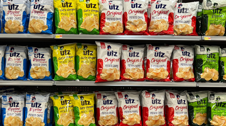 various bags of Utz brand potato chips on grocery store shelves