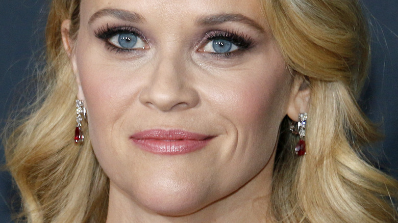 Reese Witherspoon with dangling earrings, curly hair