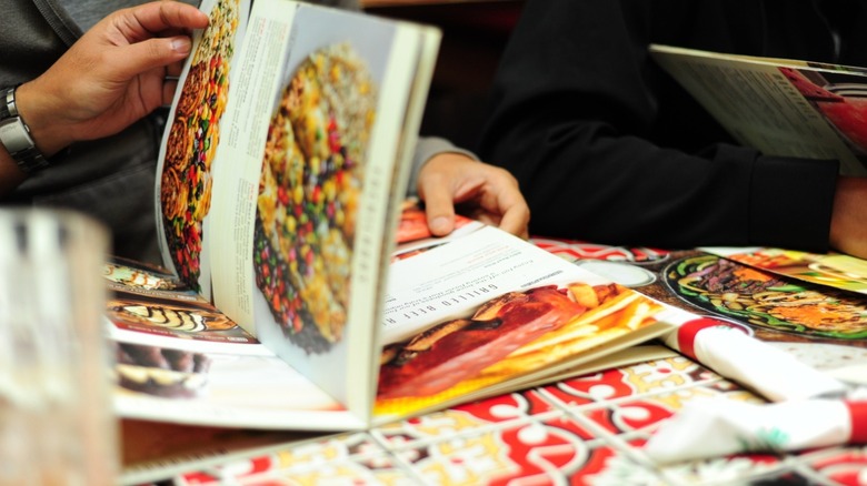 Customers read a menu