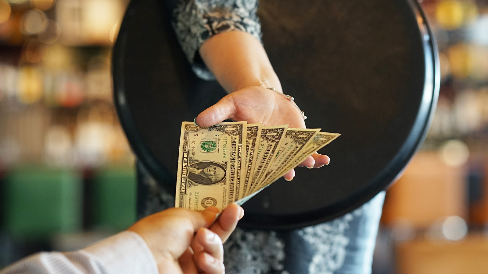 How Restaurant Workers Might Be Paying To Keep Their Own Wages Low