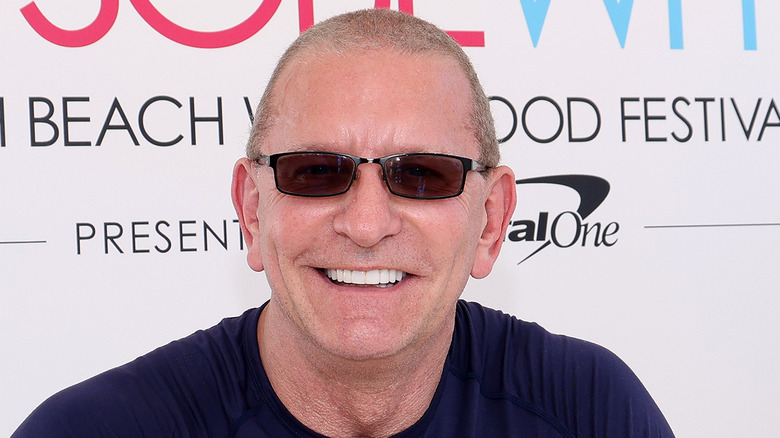 Robert Irvine smiling and wearing sunglasses