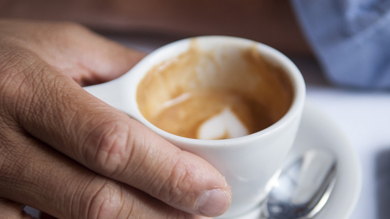 cappucino in someone's hand