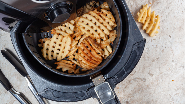 Waffle fries inside air fryer