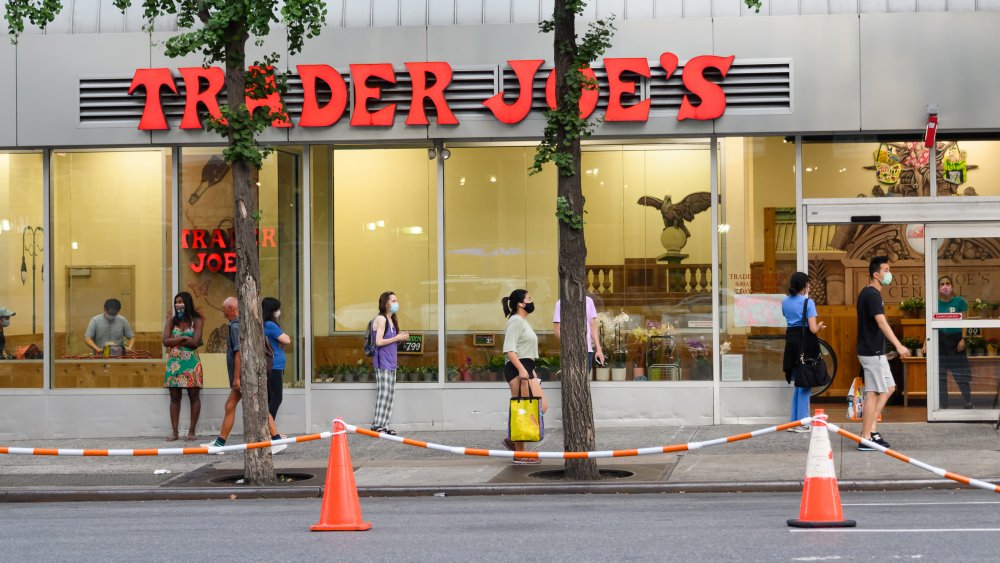 People practicing social distancing outside Trader Joe's 