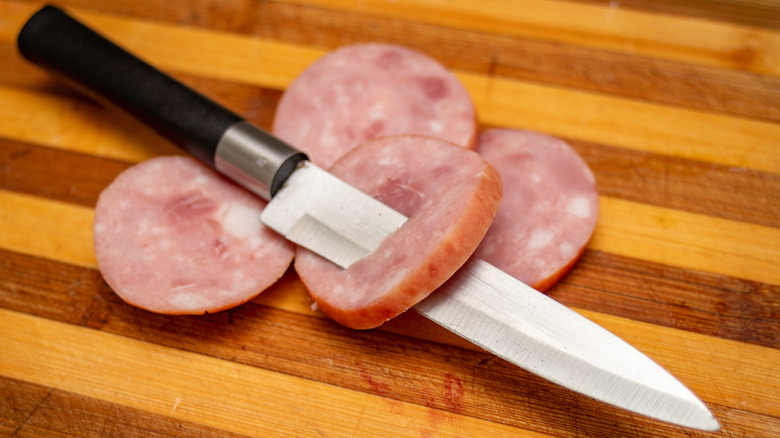 Knife through a piece of ham