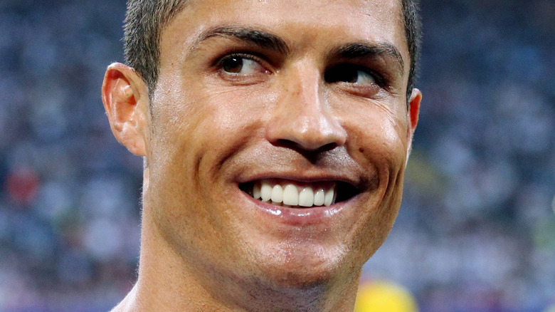 Cristiano Ronaldo smiling on the soccer field