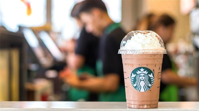 Starbucks Frappuccino with background workers