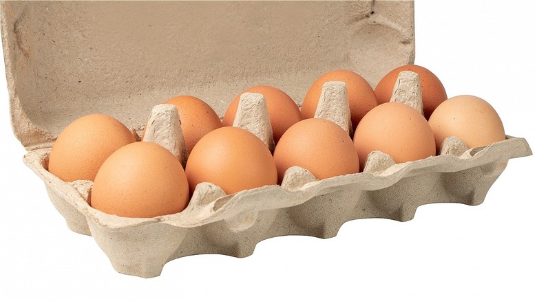 Eggs in an open egg carton. 