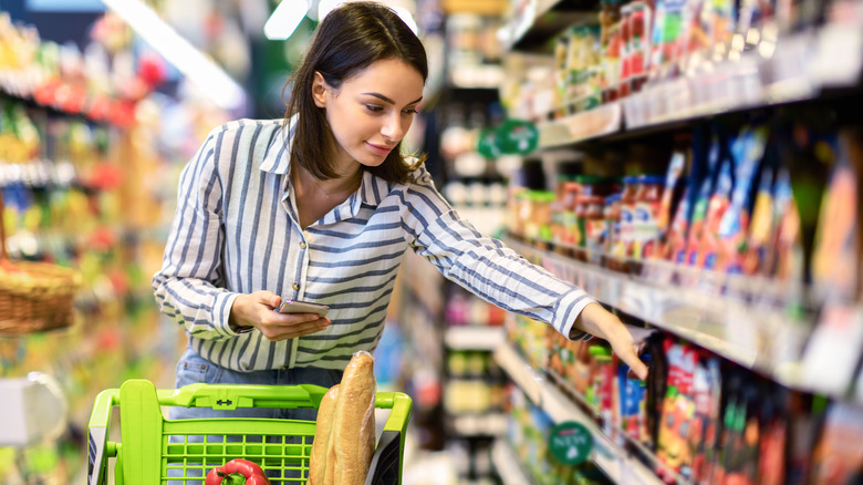 Woman picking products in grocery store