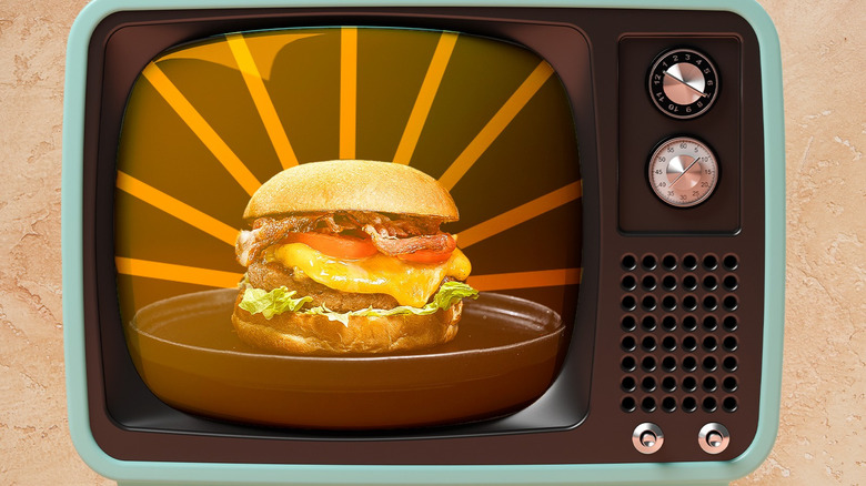 burger with sunburst on vintage television