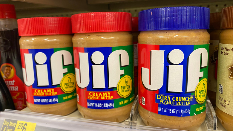 jars of jif peanut butter on store shelf