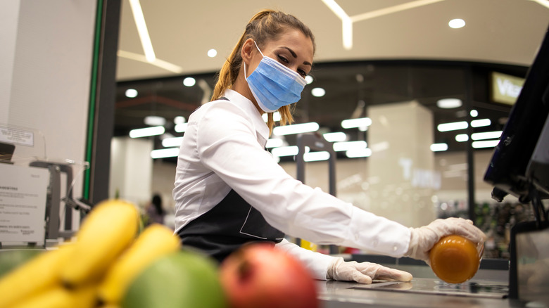 Cashier scanning an item