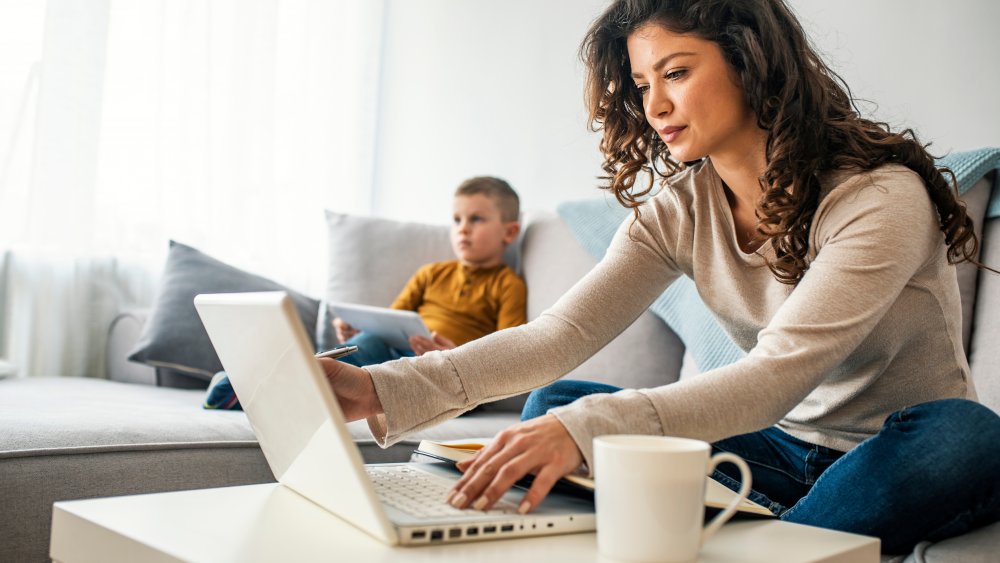 Woman working from home with coffee mug