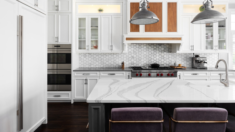 Modern light colored kitchen with silver accents