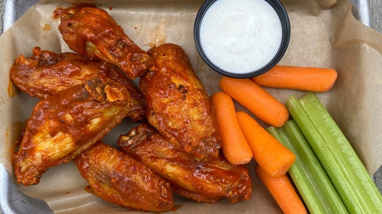 Chicken wings with carrots and celery