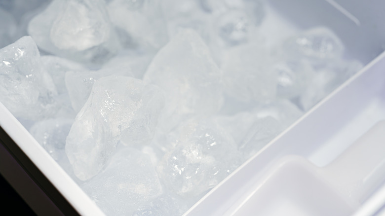 close up of ice cubes in ice maker