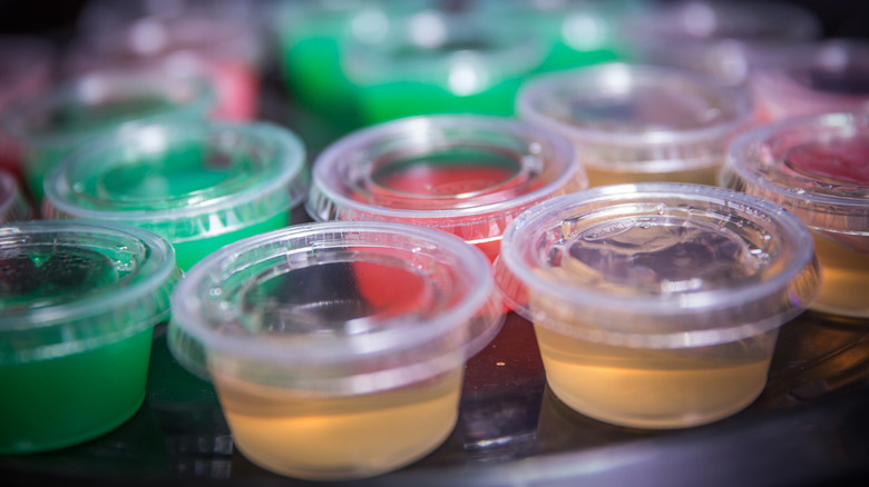 multicolored Jell-O shots in containers