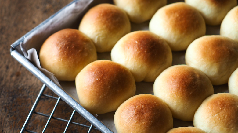 Tray of golden-brown dinner rolls