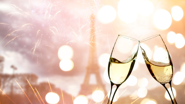 Champagne flutes in front of Eiffel Tower