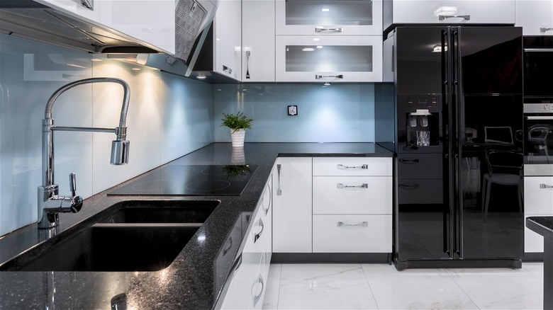 Kitchen with black stainless steel appliances