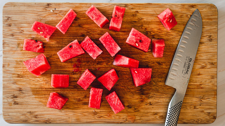 watermelon cubes and a knife